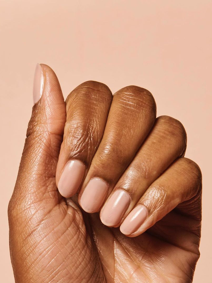 nude nail polish on dark brown skin