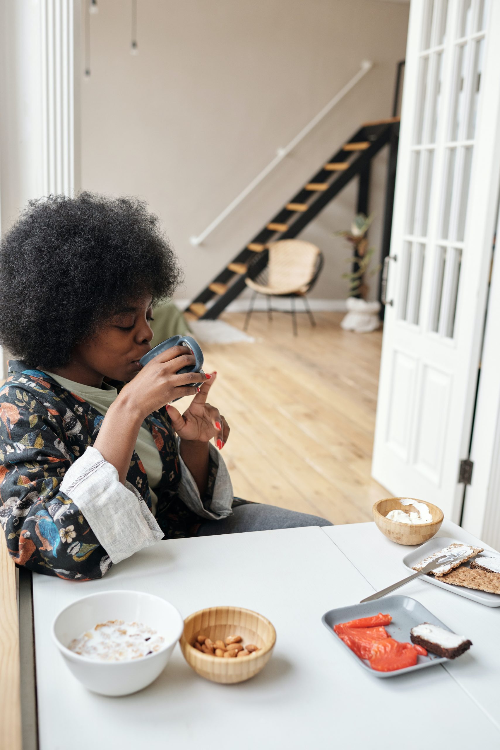 black woman drinking coffee for morning routine