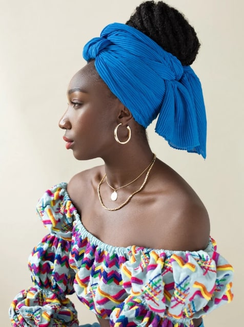 Black woman in headwrap protecting and covering edges