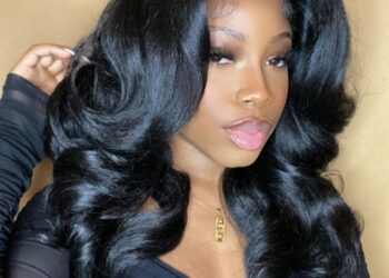 Black woman wearing premium synthetic wig that looks natural
